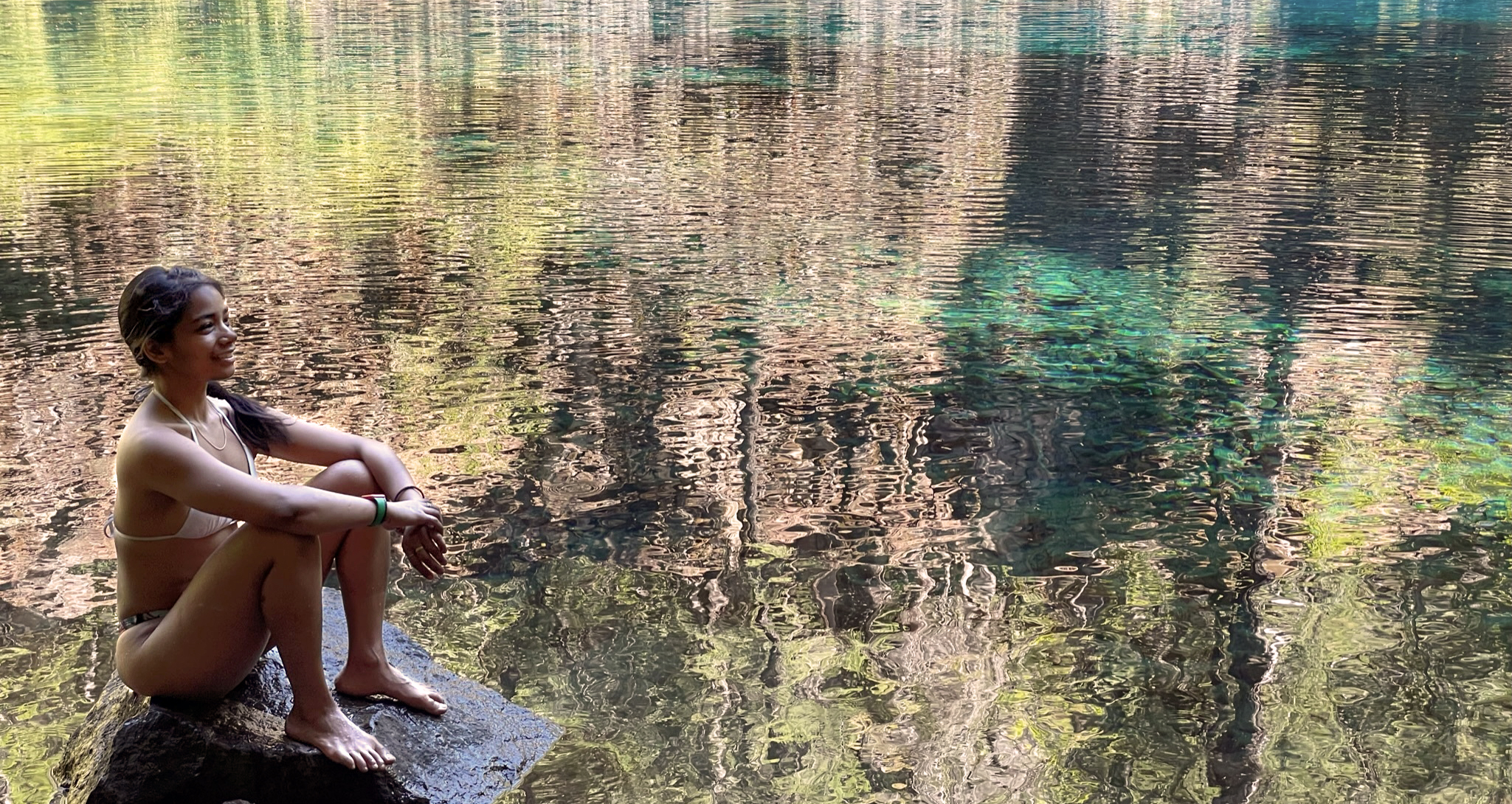 woman cold plunging at a lake