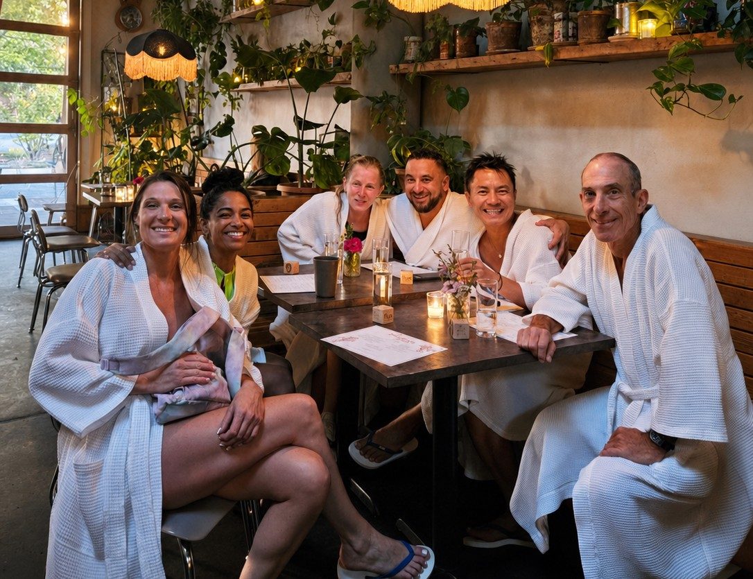 Guests in robes enjoying cocktails at Flamingo Room